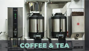 Coffee and tea dispensers on a counter.