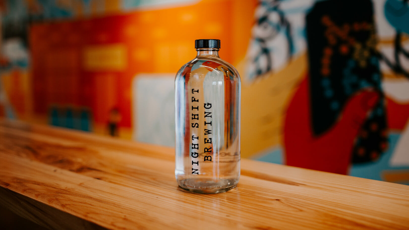 A Night Shift branded bottle on a counter.