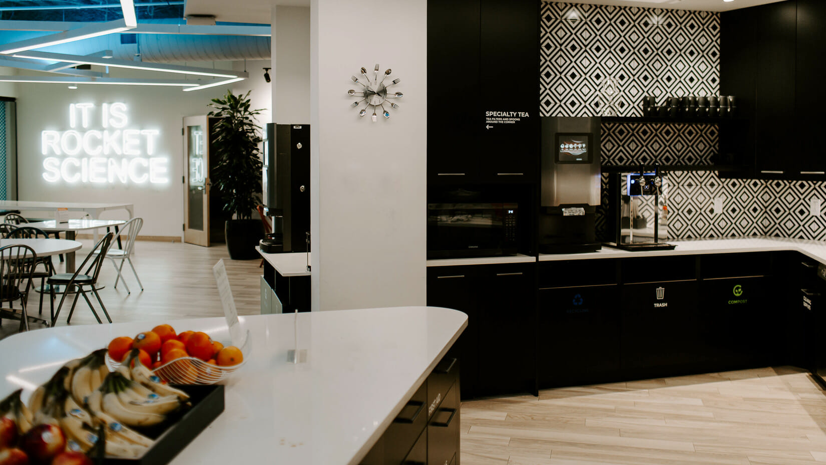 An office setting with a bluedrop water product sitting on the counter.