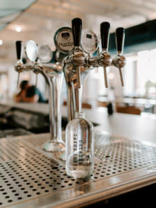 A custom bluedrop bottle being filled in a restaurant.