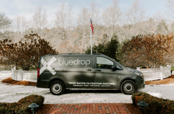 A bluedrop water branded van.