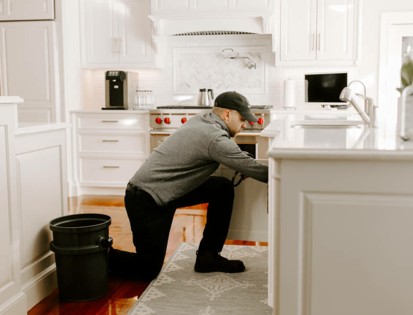 A person installing or adjusting the reverse osmosis system.