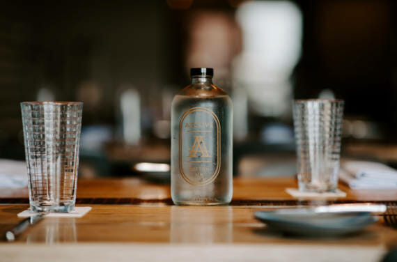 A bottle sitting on a restaurant table at Alcove in Boston.
